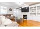 Cozy living room with hardwood floors, fireplace, built-in shelving, and lots of natural light at 2610 Oglethorpe Ne Cir, Brookhaven, GA 30319