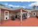 Back porch with outdoor kitchen, barbecue grill and dining table at 2716 Georgia 16, Carrollton, GA 30116