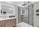 Modern bathroom featuring a frameless glass shower, sleek vanity and well-lit mirror at 2716 Georgia 16, Carrollton, GA 30116