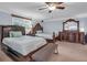 Bedroom with two full beds, dark wood furniture, carpeted floors and a ceiling fan at 2716 Georgia 16, Carrollton, GA 30116