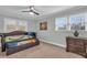 Charming bedroom with natural light, decorative dresser and unique pull-out style bed frame at 2716 Georgia 16, Carrollton, GA 30116