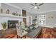 Bright dining area with fireplace, glass table, modern chairs, and elegant decor, perfect for gatherings at 2716 Georgia 16, Carrollton, GA 30116