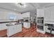 Well-lit kitchen featuring an island, stainless steel appliances, white cabinets and a breakfast nook at 2716 Georgia 16, Carrollton, GA 30116