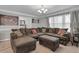 Cozy living room with plush sectional sofa, and decorative accents, creating a warm and inviting atmosphere at 2716 Georgia 16, Carrollton, GA 30116