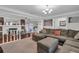 Spacious living room features hardwood floors, fireplace, and large comfortable sectional sofa, great for relaxing at 2716 Georgia 16, Carrollton, GA 30116