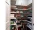 Walk-in pantry offers ample storage space with multiple shelves for easy organization of kitchen essentials at 2716 Georgia 16, Carrollton, GA 30116