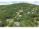 Lush green neighborhood with an aerial view of scattered homes and winding roads at 2936 Summitop Ne Rd, Marietta, GA 30066