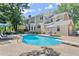 Stunning backyard with a sparkling pool, lounge areas, and a spacious deck for outdoor living at 2936 Summitop Ne Rd, Marietta, GA 30066