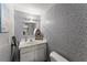 Cozy powder room with decorative wallpaper, a vessel sink, and ample counter space providing convenience and charm at 2936 Summitop Ne Rd, Marietta, GA 30066