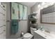 Bathroom showcasing a vanity, toilet, and bathtub/shower combination with tiled walls and stylish fixtures at 2936 Summitop Ne Rd, Marietta, GA 30066