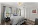 Cozy bedroom features hardwood floors, a comfortable bed, and stylish décor at 2936 Summitop Ne Rd, Marietta, GA 30066