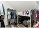 Walk-in closet with extensive storage including shelving, rods for hanging clothing, and space for shoes at 2936 Summitop Ne Rd, Marietta, GA 30066