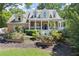 Beautifully landscaped brick home featuring a classic front porch and well-maintained yard at 2936 Summitop Ne Rd, Marietta, GA 30066