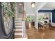 Inviting foyer with hardwood floors, staircase, and a glimpse into the living spaces at 2936 Summitop Ne Rd, Marietta, GA 30066