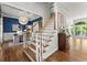 Elegant foyer with hardwood floors, staircase, and stylish decor, providing a warm entrance at 2936 Summitop Ne Rd, Marietta, GA 30066
