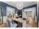 Bright home office with hardwood floors, large desk, and staircase access at 2936 Summitop Ne Rd, Marietta, GA 30066