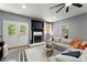 Comfortable living room with a fireplace, large sofa, and stylish decor, perfect for relaxation and entertaining at 2936 Summitop Ne Rd, Marietta, GA 30066
