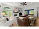 Cozy living room with white brick fireplace, built-in shelving, and comfortable seating area at 2936 Summitop Ne Rd, Marietta, GA 30066