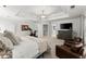 Spacious primary bedroom suite with tray ceiling, sitting area, and carpet flooring at 2936 Summitop Ne Rd, Marietta, GA 30066