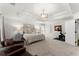 Bright primary bedroom featuring tray ceiling, plush carpet, and ample natural light at 2936 Summitop Ne Rd, Marietta, GA 30066