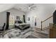 Spacious bedroom with a ceiling fan and open access to bathroom at 2936 Summitop Ne Rd, Marietta, GA 30066