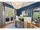 Bright office features a large window, custom desk, and elegant chandelier, creating a stylish workspace at 2936 Summitop Ne Rd, Marietta, GA 30066