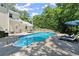Refreshing pool surrounded by lounge chairs, perfect for enjoying sunny days in a private backyard oasis at 2936 Summitop Ne Rd, Marietta, GA 30066