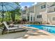 Relaxing poolside retreat with comfortable lounge chairs, a shaded seating area, and a beautiful pool at 2936 Summitop Ne Rd, Marietta, GA 30066