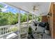 Spacious covered porch with comfortable seating, ceiling fans, and charming rocking chairs at 2936 Summitop Ne Rd, Marietta, GA 30066