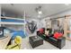 Versatile recreation room with bunk beds, comfortable seating, and a sliding barn door with glass panels at 2936 Summitop Ne Rd, Marietta, GA 30066