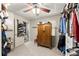 Walk-in closet with custom shelving, hanging racks, and a shoe organizer at 2936 Summitop Ne Rd, Marietta, GA 30066
