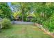 Spacious backyard enclosed by a fence and lush trees, creating a private outdoor space at 378 Grant Park Pl, Atlanta, GA 30315