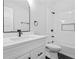 Modern bathroom featuring white cabinets, quartz counters, and sleek black fixtures at 378 Grant Park Pl, Atlanta, GA 30315