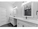 Bathroom with a double vanity, modern fixtures, and a walk-in shower at 378 Grant Park Pl, Atlanta, GA 30315
