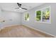 Well-lit bedroom showcasing hardwood floors and inviting double windows bringing in natural light at 378 Grant Park Pl, Atlanta, GA 30315