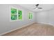 Spacious bedroom is bathed in natural light with its expansive windows and hardwood flooring at 378 Grant Park Pl, Atlanta, GA 30315