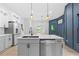 Spacious kitchen with a large island, stainless steel appliances, and pendant lighting at 378 Grant Park Pl, Atlanta, GA 30315