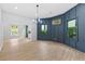 Bright living space with paneling detail and access to the outdoor area, flowing into other living areas at 378 Grant Park Pl, Atlanta, GA 30315