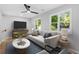 Living room features abundant natural light, modern decor, and comfortable seating at 378 Grant Park Pl, Atlanta, GA 30315