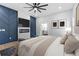 Large main bedroom featuring a modern fireplace and an en suite bathroom at 378 Grant Park Pl, Atlanta, GA 30315