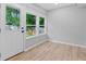 Bright sunroom with natural light, hardwood floors, and access to the backyard at 378 Grant Park Pl, Atlanta, GA 30315