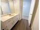 Bathroom features a white vanity and hardwood floors at 6370 Maid Marion Close, Alpharetta, GA 30005