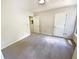 Bedroom with neutral carpet, paint and two doors at 6370 Maid Marion Close, Alpharetta, GA 30005