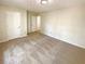 Unfurnished bedroom with neutral carpet, two doors, and great natural light at 6370 Maid Marion Close, Alpharetta, GA 30005