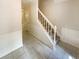 Entryway foyer with staircase featuring tile floors, white trim, and great natural light at 6370 Maid Marion Close, Alpharetta, GA 30005