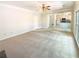 Spacious living room with neutral carpeting, recessed lighting, and an open floor plan leading to the kitchen at 6370 Maid Marion Close, Alpharetta, GA 30005
