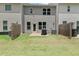 Backyard featuring patio area, lawn, and wooden fence at 6780 Cedar Glen Rd, Peachtree Corners, GA 30360
