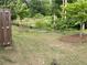Spacious backyard with a firepit area and wooded backdrop offers a tranquil outdoor setting at 6780 Cedar Glen Rd, Peachtree Corners, GA 30360