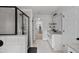 Long bathroom featuring a glass shower, long vanity with granite countertop, and ample space at 6780 Cedar Glen Rd, Peachtree Corners, GA 30360