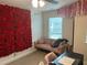 Unique bedroom space features rose wall and pink couch at 6780 Cedar Glen Rd, Peachtree Corners, GA 30360